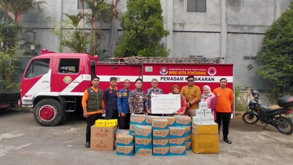 Penyaluran paket masker medis dan vitamin TelkomGroup bagi warga terdampak karhutla di Kalimantan - sumber dari telkom.co.id